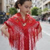Mantoncillo flamenca de niña en color rojo bordado en varios colores y flecado a mano, el complemento de flamenca ideal para las más pequeñas de casa.
