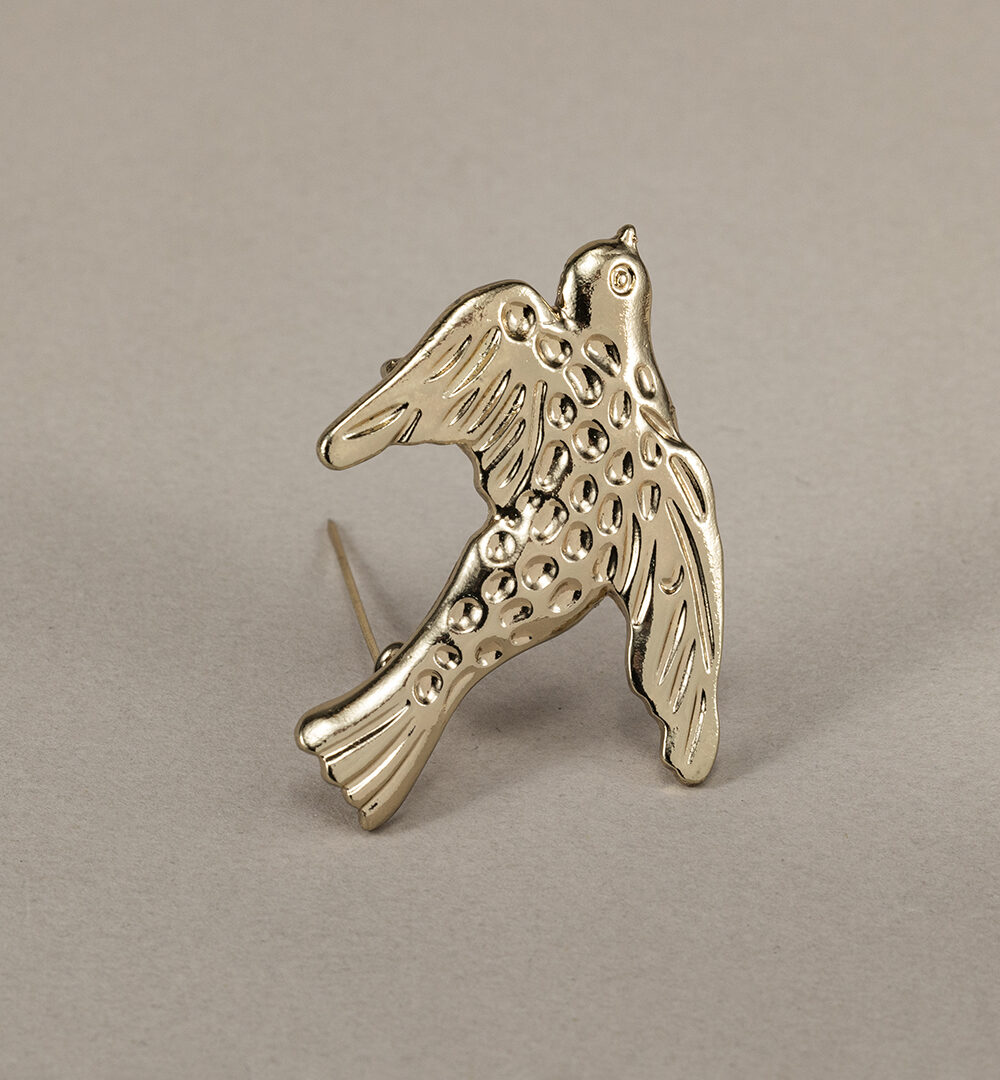 Broche golondrina dorada